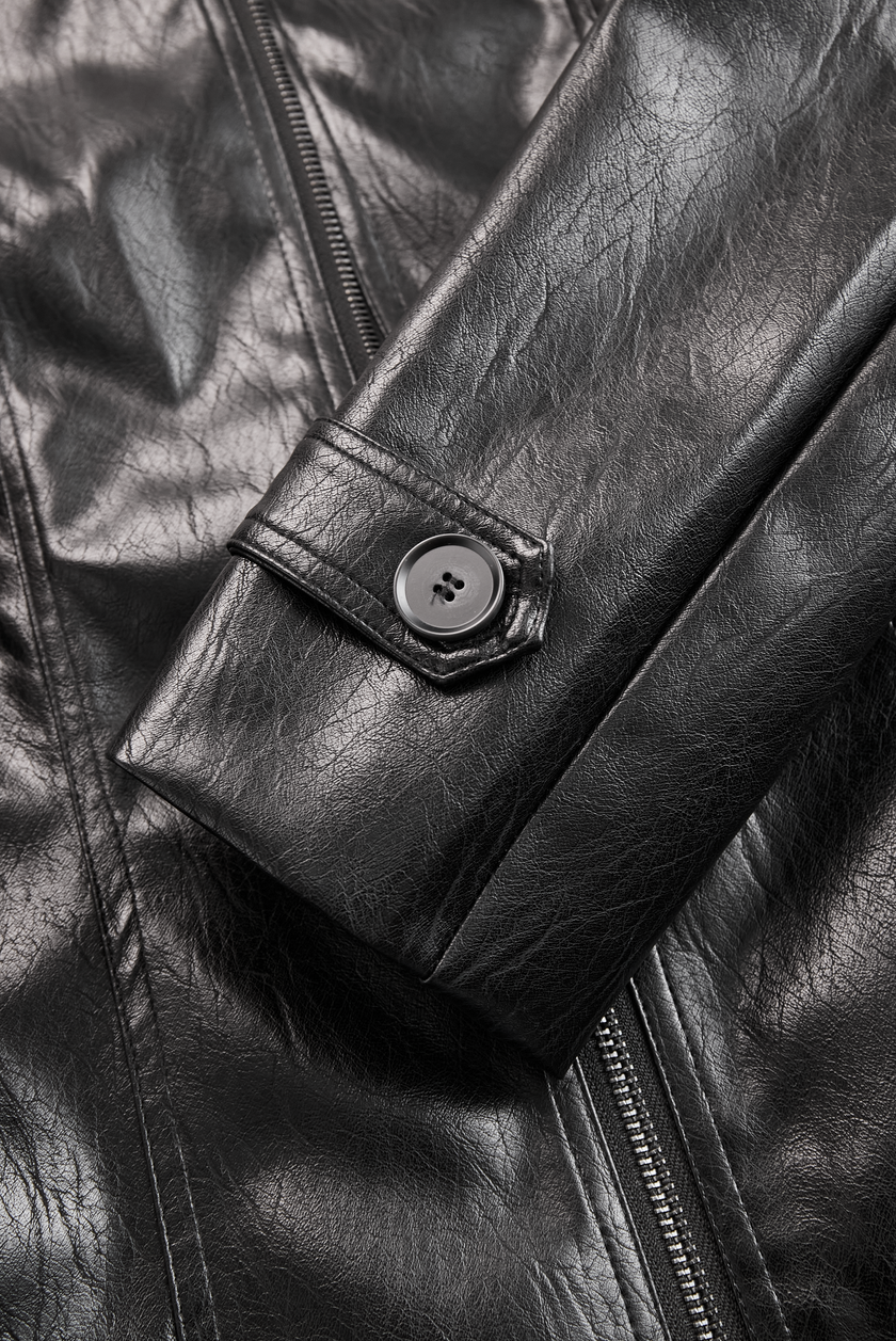 FJØRNA black vintage faux leather jacket with stand collar, stylish outerwear with classic design and textured material.