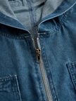 FJØRNA casual loose retro denim jumpsuit with long sleeves, hood, zipper closure, and front pockets, styled for a relaxed look.