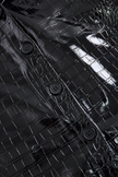 Black embossed FJØRNA women's sleeveless shirt with crocodile texture and glossy finish, showcasing a stylish, textured top.