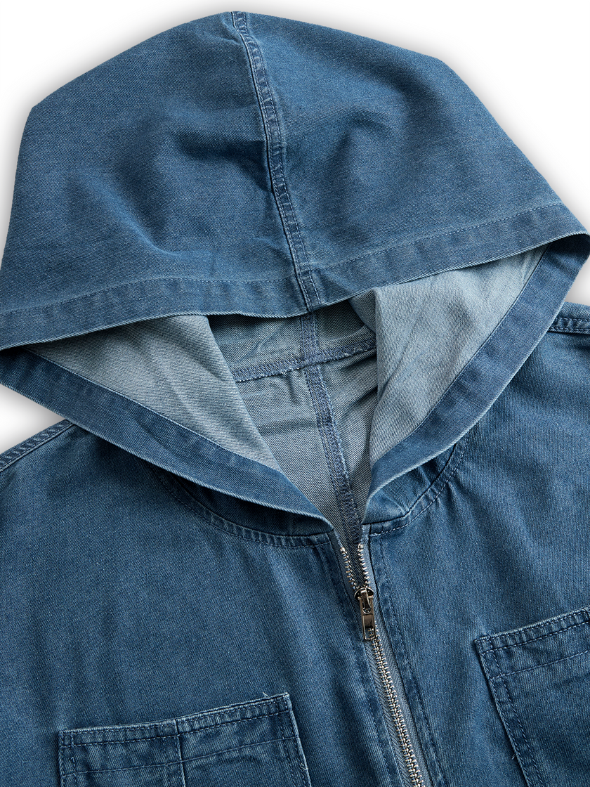 FJØRNA casual loose retro denim jumpsuit with long sleeves, hood, zipper, and front pockets, styled for a relaxed look.
