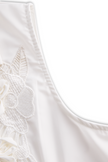 FJØRNA women's sleeveless white blouse with floral embroidery and 3D appliqué, casual top with intricate embroidered details.