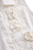 FJØRNA white sleeveless floral embroidery blouse for women with 3D appliqué and intricate design, shown on a model.