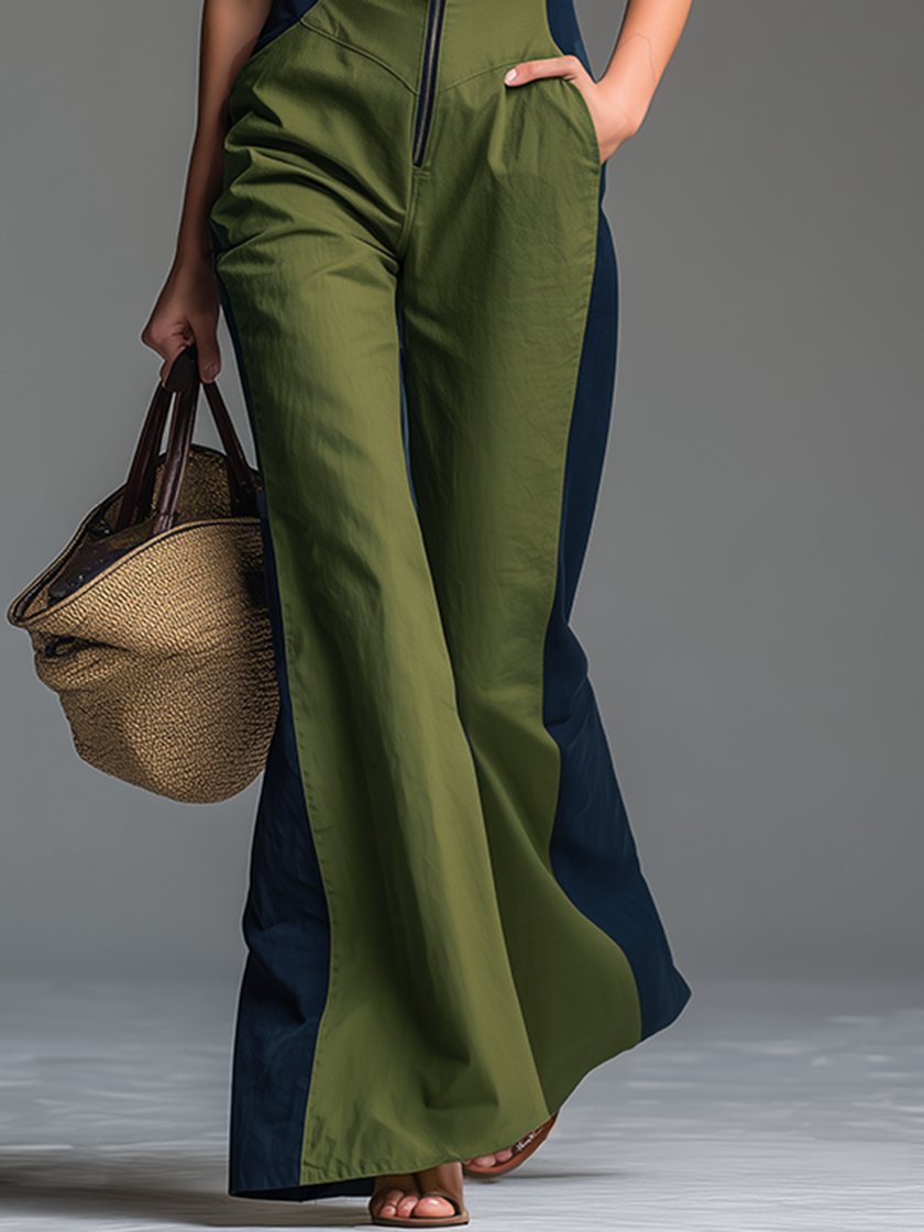 FJØRNA green sleeveless jumpsuit with stand collar and front zip-up closure, casual style, displayed on a hanger.