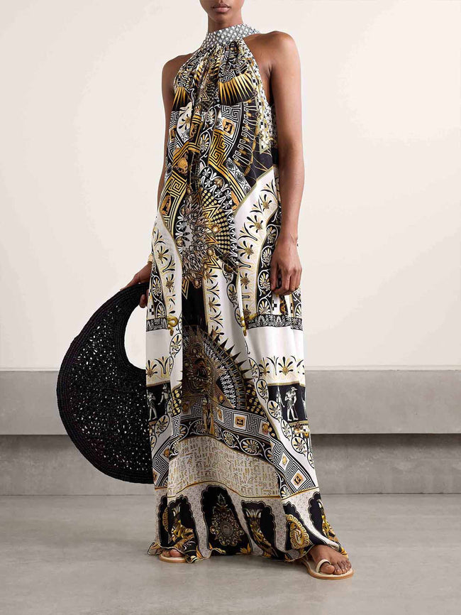 FJØRNA women's maxi dress with vibrant retro pattern print, perfect for summer, stylish and flowing for warm weather wear.