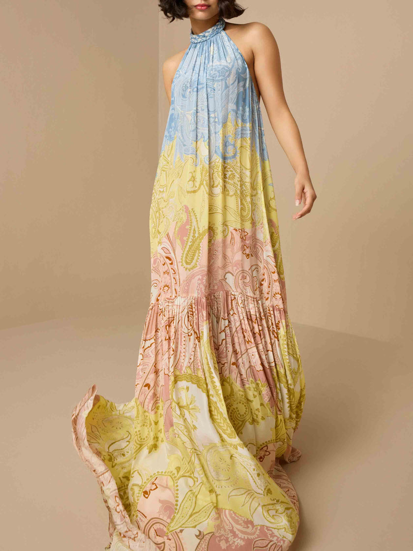 Elegant paisley print braided halter maxi dress by FJØRNA, featuring a flowing silhouette and intricate design.
