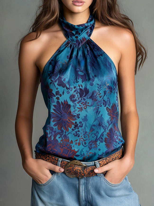 FJØRNA teal floral satin high-neck blouse with long sleeves and a high collar, featuring a vibrant floral print.