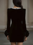 FJØRNA elegant velvet mini dress featuring an embellished neckline and floral cuff details, perfect for stylish women.