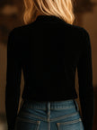 Black FJØRNA velvet V-neck long sleeve top with embroidered design, featuring a stylish and comfortable T-shirt silhouette.