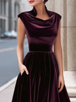 FJØRNA velvet cowl-neck sleeveless evening gown, A-line maxi dress with elegant design and flowing fabric, perfect for formal occasions.