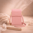 FJØRNA women's crossbody bag in black leather with adjustable strap and minimalist design, perfect for everyday use.