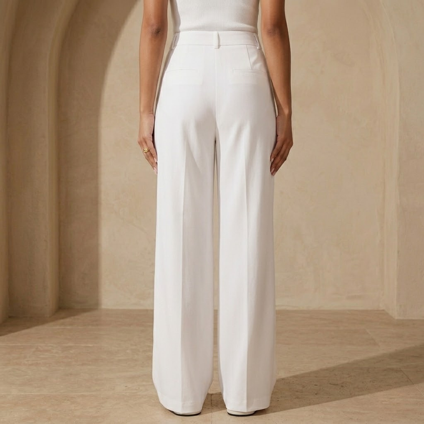 High waist wide-leg tailored women's pants by FJØRNA, showcasing a flowy fit and stylish design.