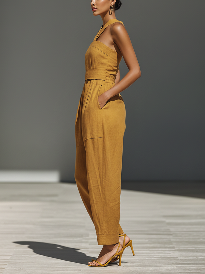 FJØRNA mustard linen-blend women's jumpsuit with crisscross neckline, relaxed fit, wide-leg pants, stylish and comfortable.