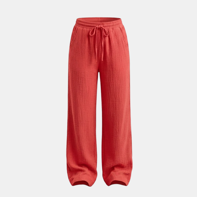 Women’s FJØRNA cotton wide-leg trousers, casual lightweight pants with a relaxed fit, shown on a model.