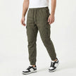 Men's slim fit cotton cargo trousers by FJØRNA, shown in a neutral color with multiple pockets and a modern tapered design.