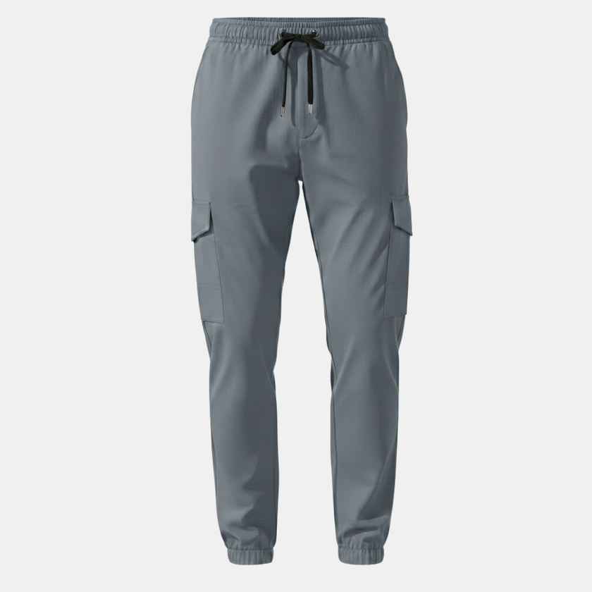 Men's cargo trousers by FJØRNA with drawstring waist, relaxed fit, featuring multiple pockets and casual style.