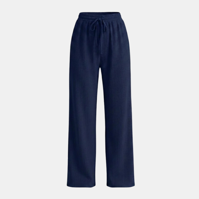 FJØRNA women's wide leg trousers with elastic waist and pleated design, featuring a relaxed fit and lightweight fabric.