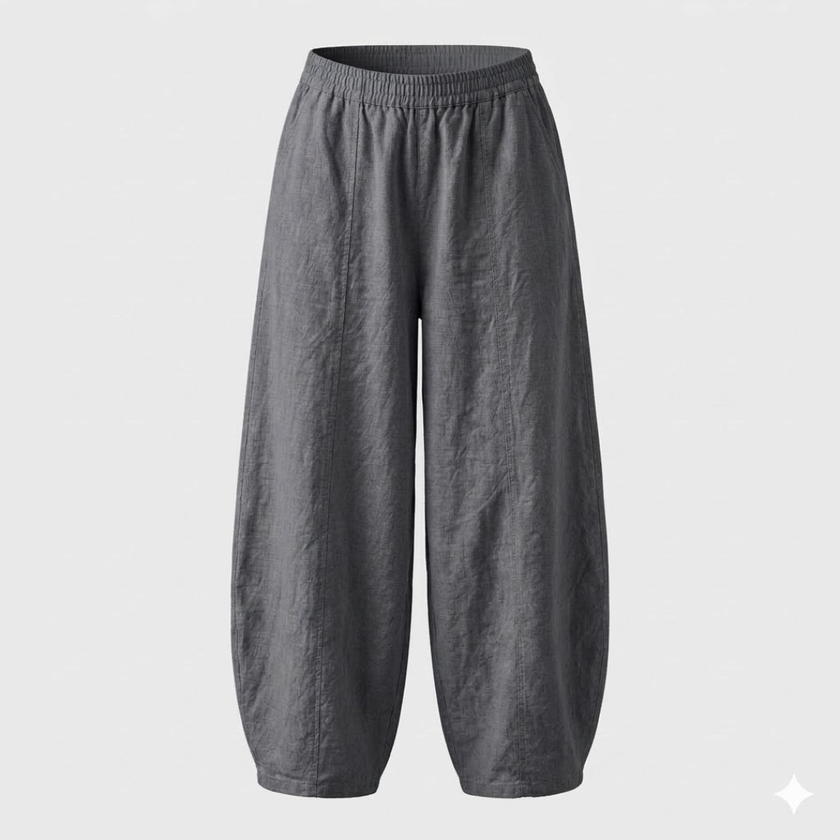 FJØRNA women's high waist cotton linen trousers with relaxed fit, showcasing the lightweight fabric and stylish tailored design.