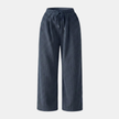 FJØRNA men's corduroy wide leg trousers with a relaxed fit, shown in a natural pose highlighting the fabric and stylish design.