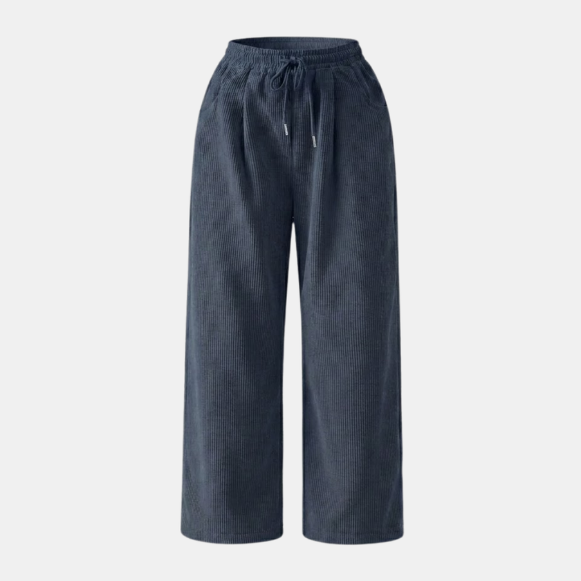 FJØRNA men's corduroy wide leg trousers with a relaxed fit, shown in a natural pose highlighting the fabric and stylish design.