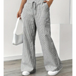 FJØRNA lightweight summer women's trousers with drawstring waist, breathable fabric, and pocket details, ideal for warm weather.