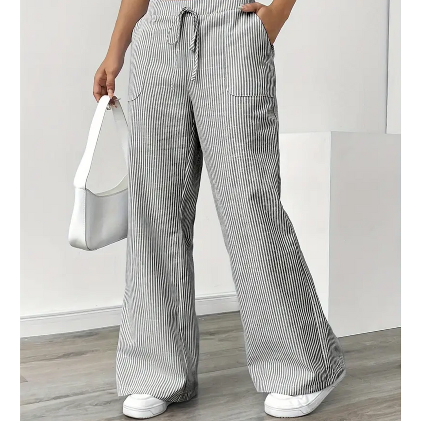 FJØRNA lightweight summer women's trousers with drawstring waist, breathable fabric, and pocket details, ideal for warm weather.