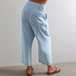 Women’s wide-leg denim jeans by FJØRNA, showcasing the relaxed fit and classic blue denim fabric.