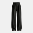 Women’s FJØRNA criss cross waist wide leg trousers, stylish pants with a high waist and relaxed fit, shown in a natural pose.