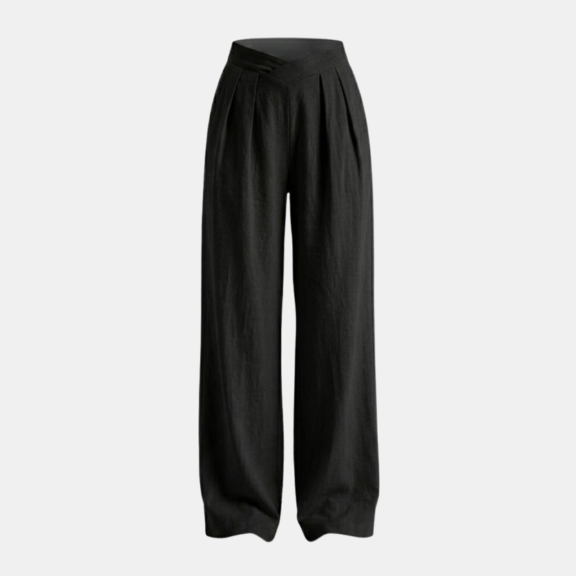 Women’s FJØRNA criss cross waist wide leg trousers, stylish pants with a high waist and relaxed fit, shown in a natural pose.