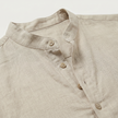 FJØRNA men's linen Henley shirt with grandad collar, roll-up sleeves, casual summer style in light linen fabric.
