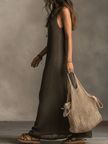 FJØRNA olive knit sleeveless maxi dress with casual, flowing silhouette, perfect for warm weather and relaxed outings.