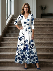 FJØRNA women's summer maxi dress with floral pattern, long sleeves, wrap style, flowy fit, perfect for warm weather.
