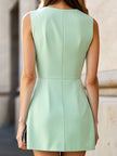 FJØRNA elegant pleated A-line mini dress, perfect for weddings, featuring a fitted bodice and flowing skirt in soft fabric.