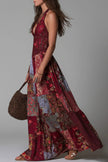 FJØRNA printed sleeveless V-neck maxi dress with fitted waist, casual style, and vibrant pattern for warm weather.