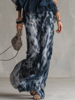 Navy blue printed wide-leg trousers for women by FJØRNA, featuring a relaxed fit and stylish pattern, displayed on a model.