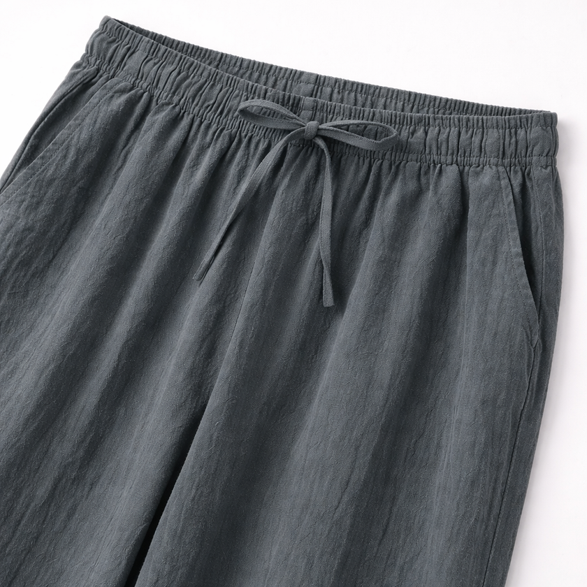 Men's linen drawstring trousers by FJØRNA, lightweight and breathable men's pants with a relaxed fit and adjustable waistband.