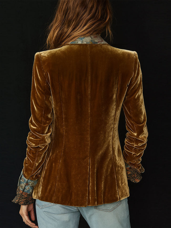 FJØRNA women's brown floral print velvet patchwork blazer with tailored fit and notch lapels, showcased on a model.