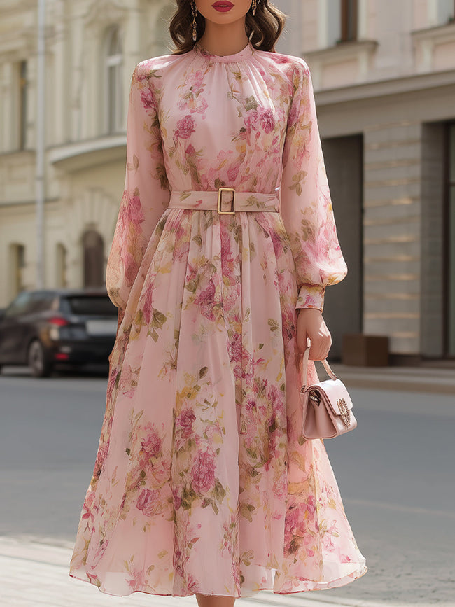 FJØRNA blush floral chiffon A-line midi dress with pink floral pattern, elegant midi length, perfect for special occasions.