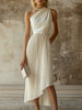 White pleated midi dress by FJØRNA, elegant evening dress with flowing fabric and classic pleats, perfect for formal occasions.