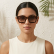 Vintage rectangular unisex sunglasses by FJØRNA with dark tinted lenses and a sleek frame, accessory for women.