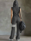 FJØRNA black sleeveless hooded jumpsuit with white striped pattern, fitted waist, and casual design, front view.