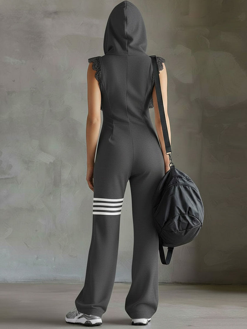 FJØRNA black sleeveless hooded jumpsuit with white striped pattern, fitted waist, and casual design, front view.