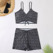 Women's printed FJØRNA tankini set with flattering fit, featuring colorful patterned swimwear top and bottom for summer swimming.