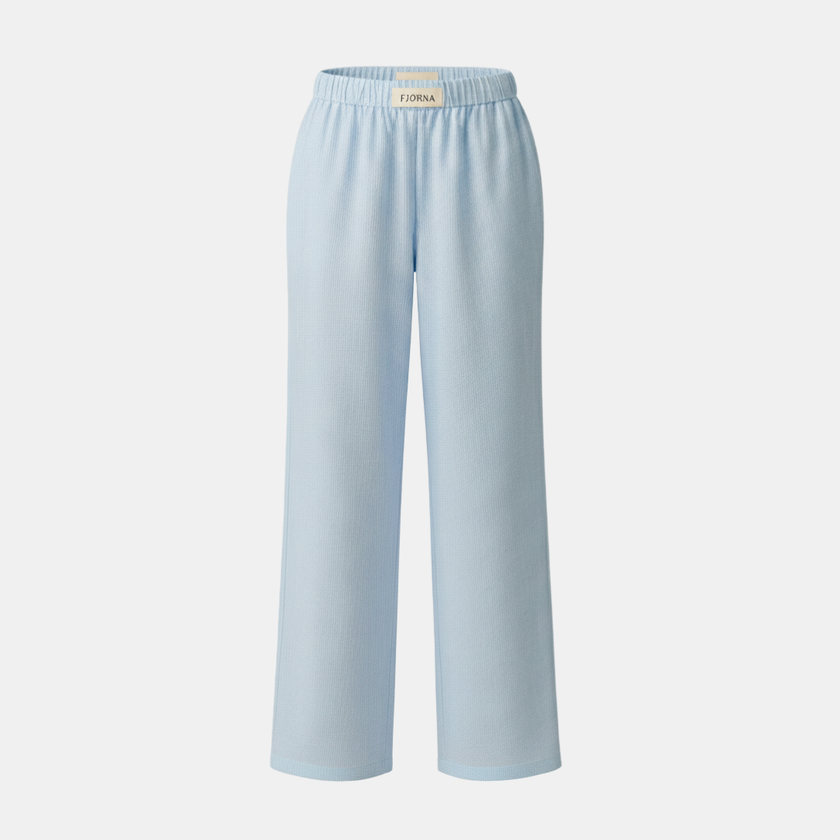 FJØRNA women's lounge trousers with elastic waist and side pockets, comfortable casual pants for relaxed wear.