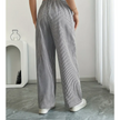 FJØRNA women's lightweight summer trousers with drawstring waist, breathable fabric, and side pockets for casual comfort.