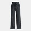 FJØRNA women's wide leg trousers with elastic waist and pleated design, shown on a model in a casual outfit.