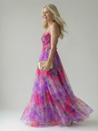 FJØRNA women's sleeveless summer maxi dress with wrap design, flowing fabric, and vibrant floral pattern.