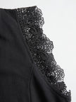 FJØRNA black sleeveless hooded jumpsuit with white striped pattern, casual fit, and front pockets, shown on a model.