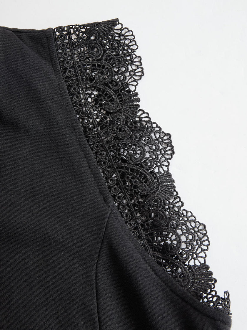 FJØRNA black sleeveless hooded jumpsuit with white striped pattern, casual fit, and front pockets, shown on a model.