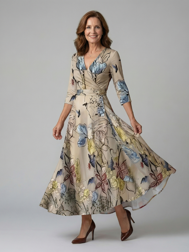 FJØRNA floral summer maxi dress for women with long sleeves, wrap style, flowy fabric, and elegant floral pattern.