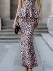 FJØRNA halter peplum midi dress for women with sculpted waist, featuring a stylish design and elegant silhouette.